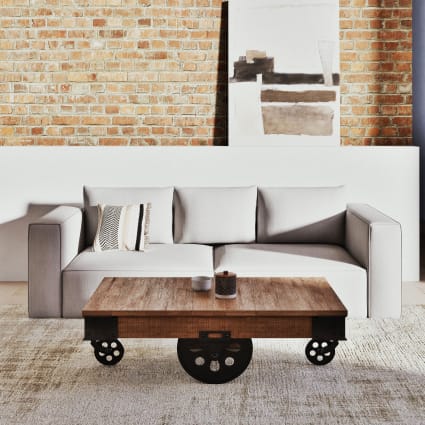 Tavolino da salotto stile industriale a rotelle in massello di mango e  metallo 130 cm