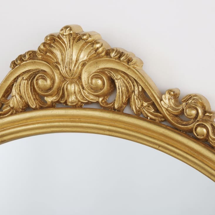 Miroir arche en métal doré vieilli et ornements