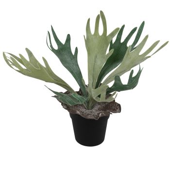 Verde artificiale in vaso di ceramica bianca, rigogliosa composizione