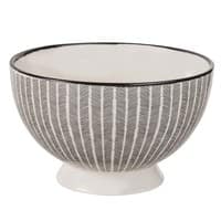 Steingut-Schale mit schwarzen Motiven Steingut-Schale mit schwarzen Motiven