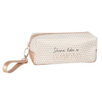 Trousse dorée et motifs graphiques Trousse dorée et motifs graphiques