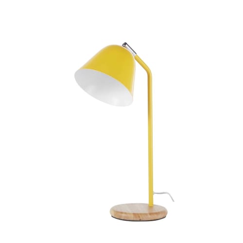 Lámpara de metal en amarillo y árbol de caucho