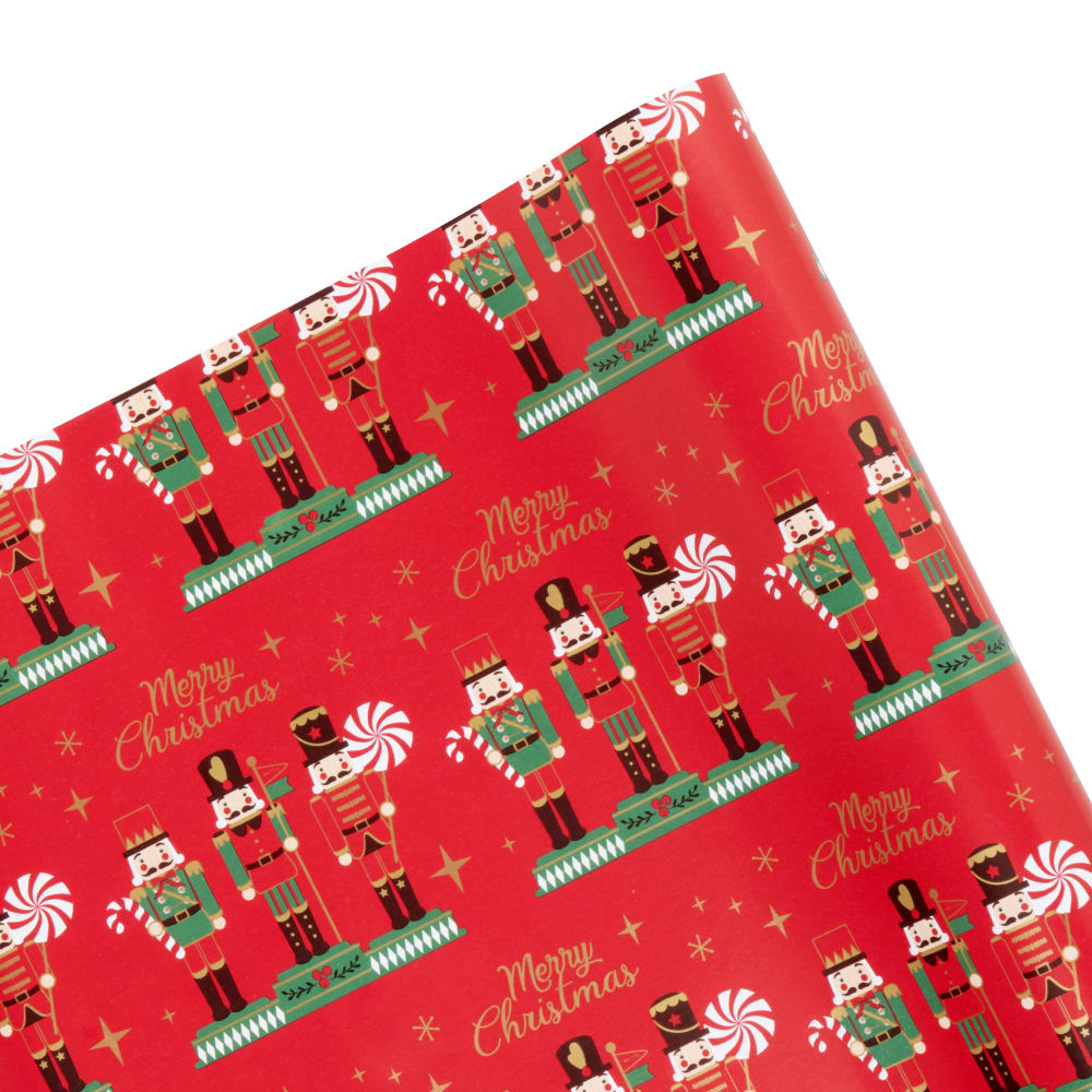 Papel de embrulho com estampado de quebra-nozes vermelho, verde e