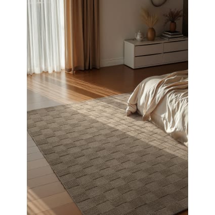 Un tapis fait de pompons colorés - Marie Claire