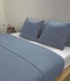 Sábana de punto 100% algodón azul para cama de 135 cm con almohada