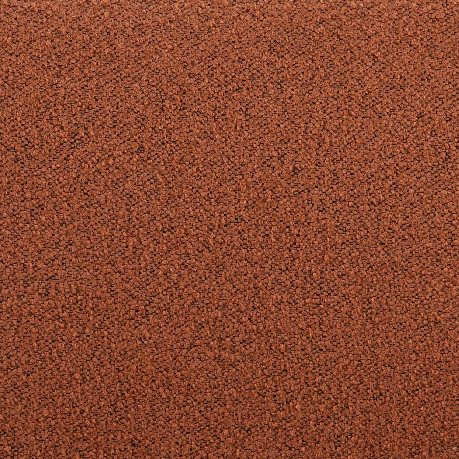Gros plan du tissu terracotta du canapé Boston montrant sa texture de bouclette.