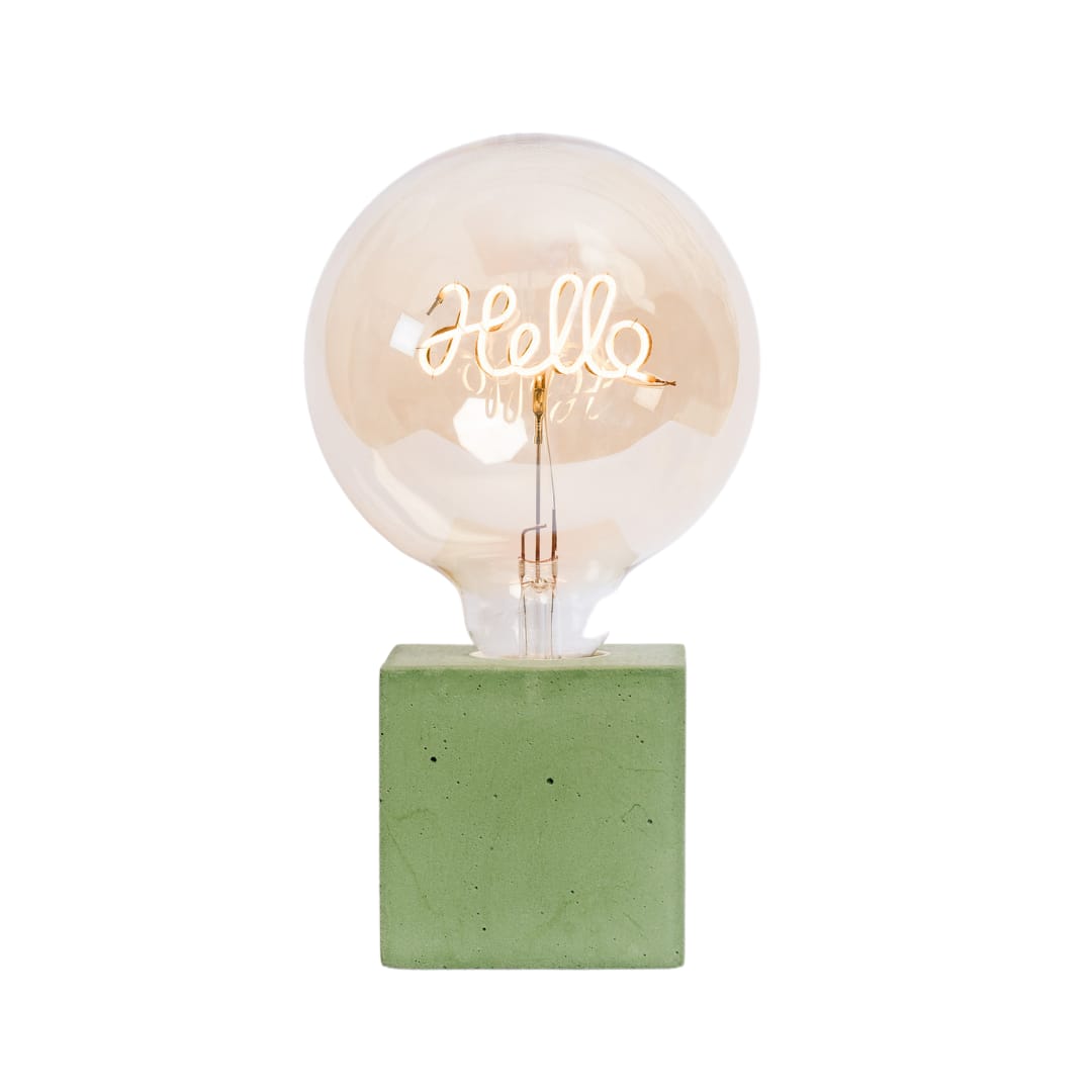 lampe à poser en béton vert avec son ampoule à message