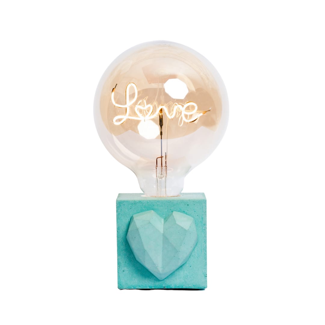 lampe à poser en béton turquoise avec son ampoule à message