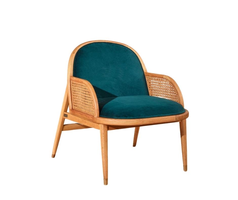 Fauteuil cannage et velours bleu paon