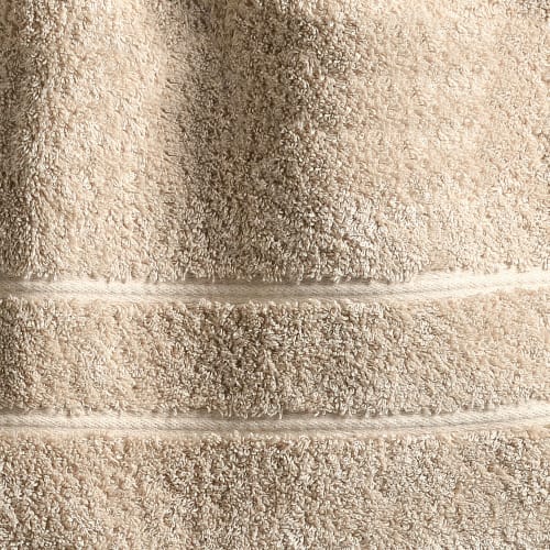 https://medias.maisonsdumonde.com/images/q_auto,f_auto/w_500/mkp/M23129834_1/drap-de-bain-100x150-beige-sable-en-coton.jpg