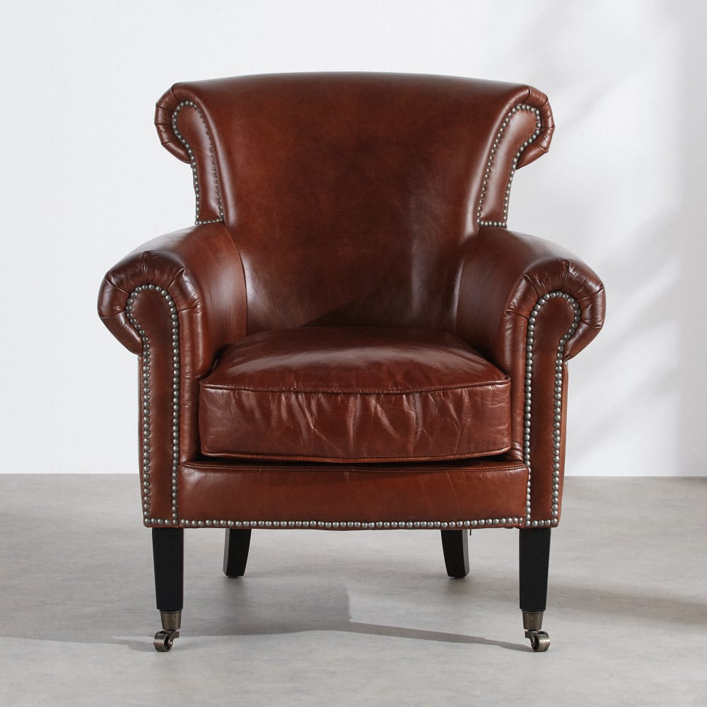 Fauteuil en cuir marron effet vieilli