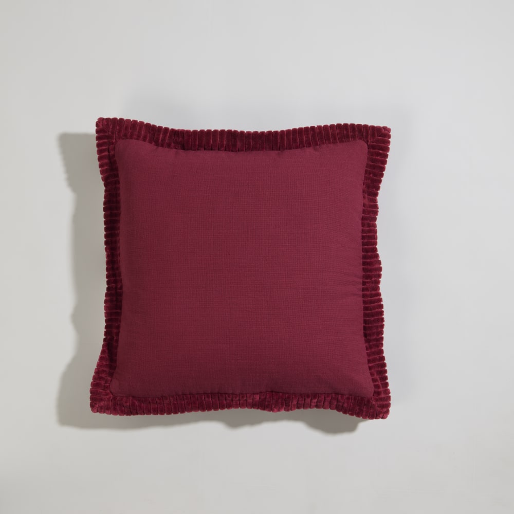 Coussin en coton et bordure en velours bordeaux 40x40