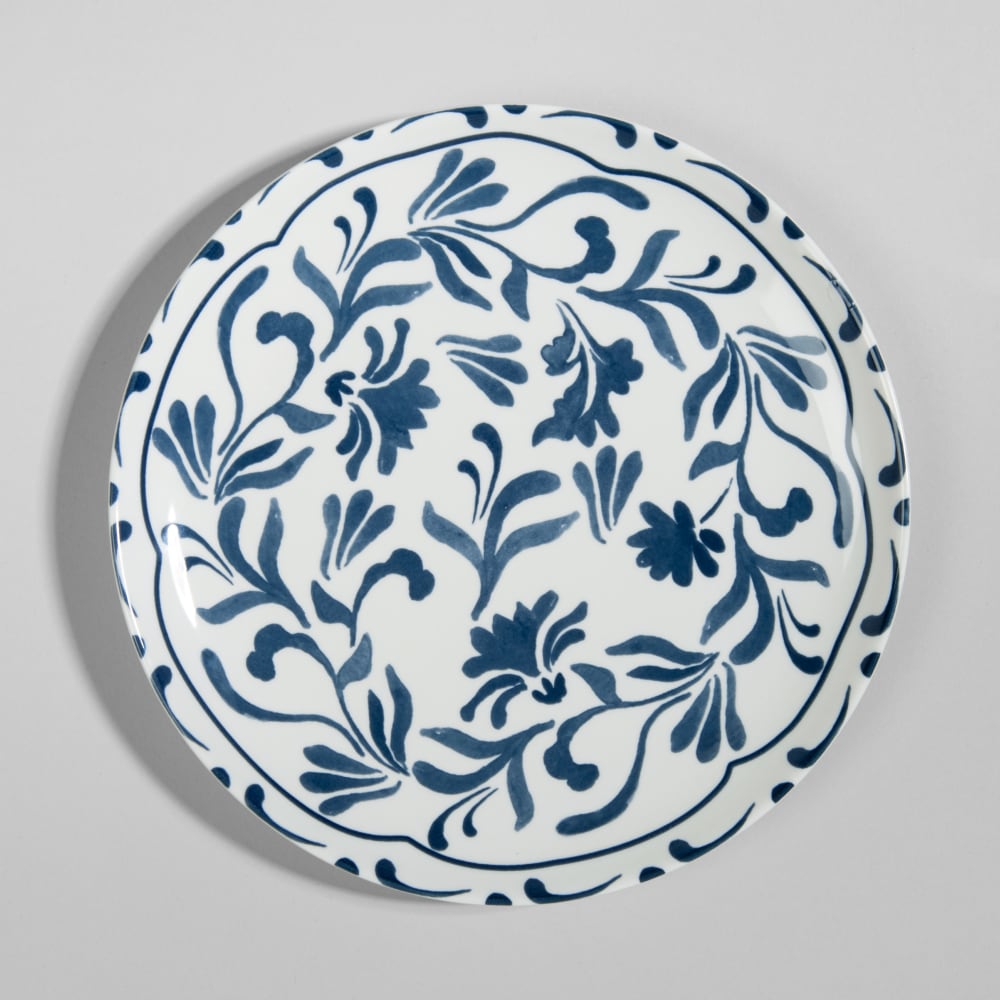 Assiette plate en céramique blanche motif floral bleu