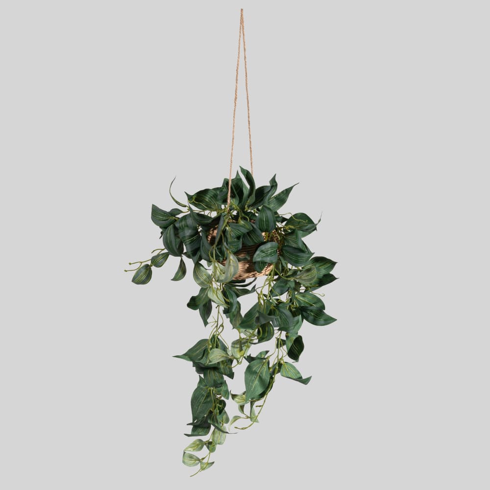 Plante verte artificielle et pot tressé