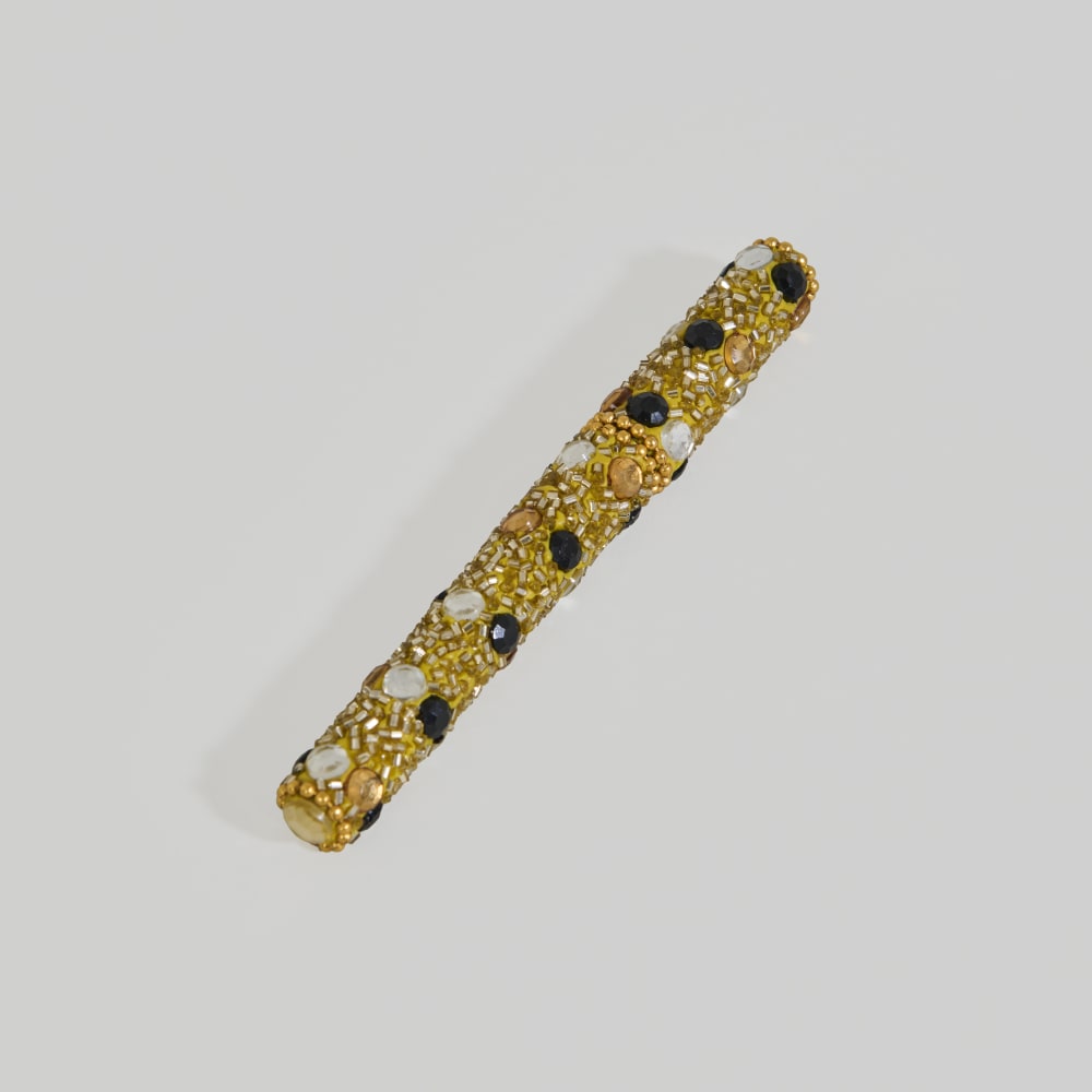 Goldener Stift mit schwarzen, goldenen und silbernen Perlen -