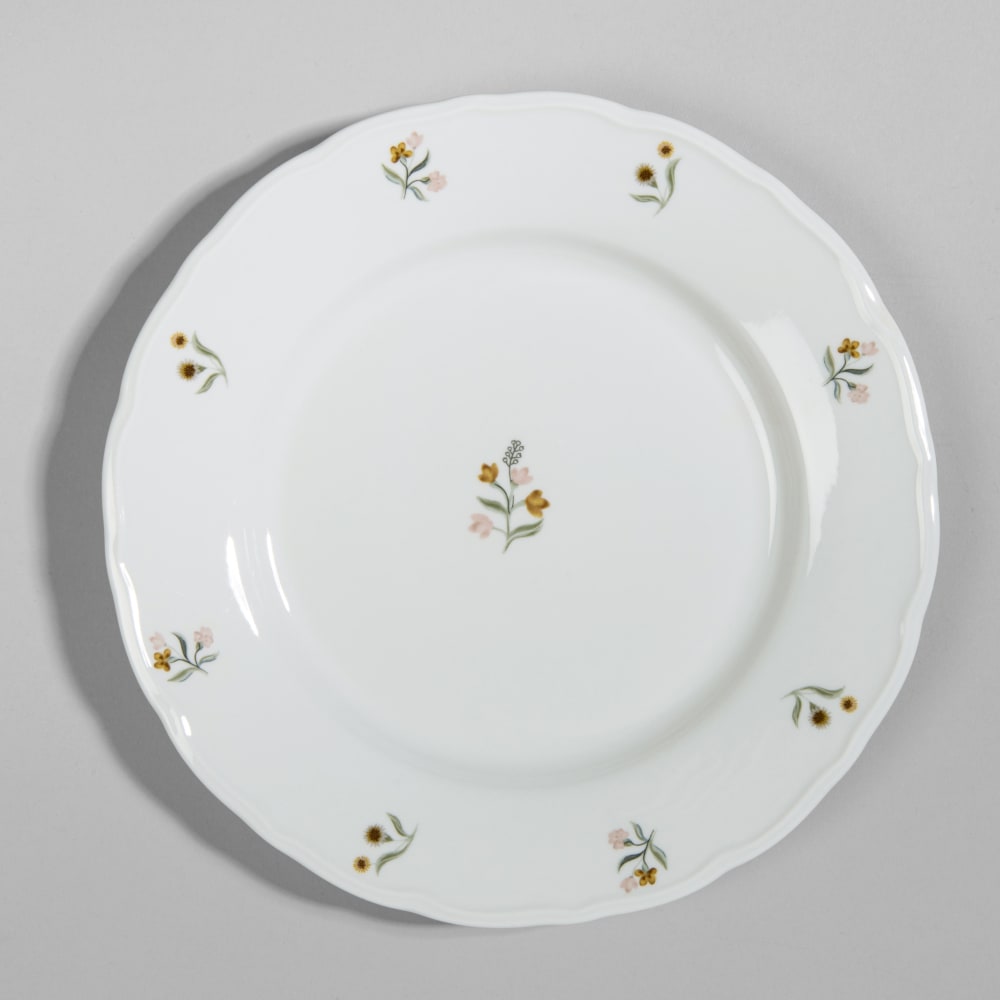 Assiette plate en porcelaine blanche à motifs