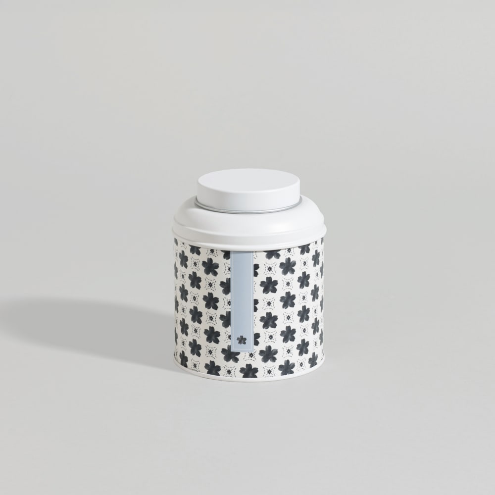 Boîte en acier blanc motifs fleurs noires Boîte en acier blanc motifs fleurs noires