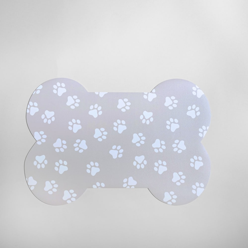 Tapis pour gamelle os en vinyle beige et blanc