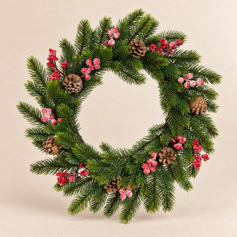 Couronne de Noël artificielle verte, baies rouges et pommes de pin