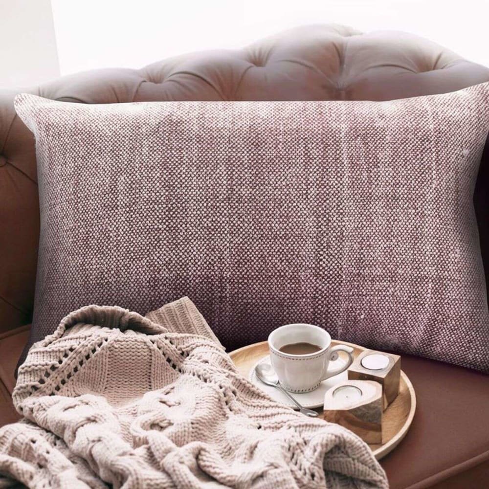 Coussin effet délavé rose poudré 60x40