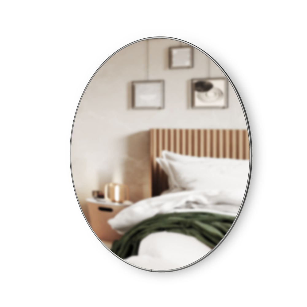 Miroir Rond 86cm bordé d'une finition en métal titanium.