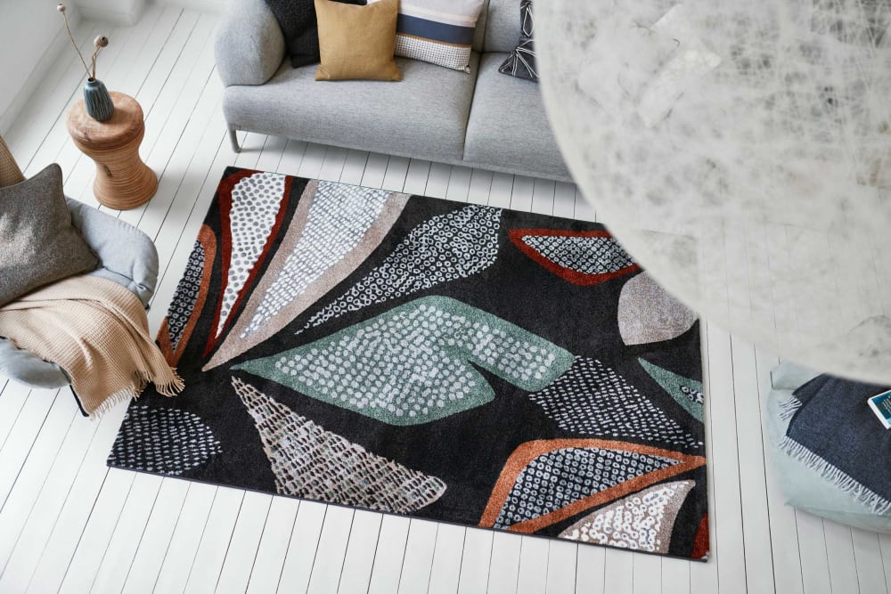 Tapis design motif végétal fond anthracite 133x200