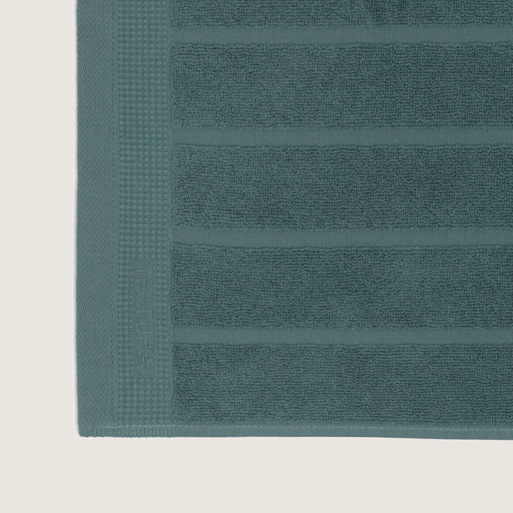 Alfombra de baño de algodón egipcio rizo color verde botella. 50x70cm - Maisons du Monde