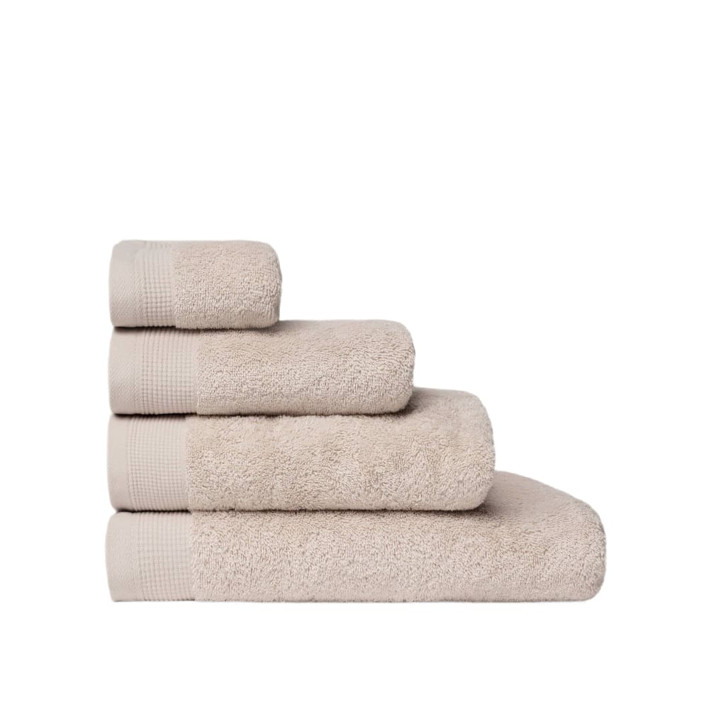 Toalla de baño de algodón egipcio de rizo piedra claro. Toalla lavabo