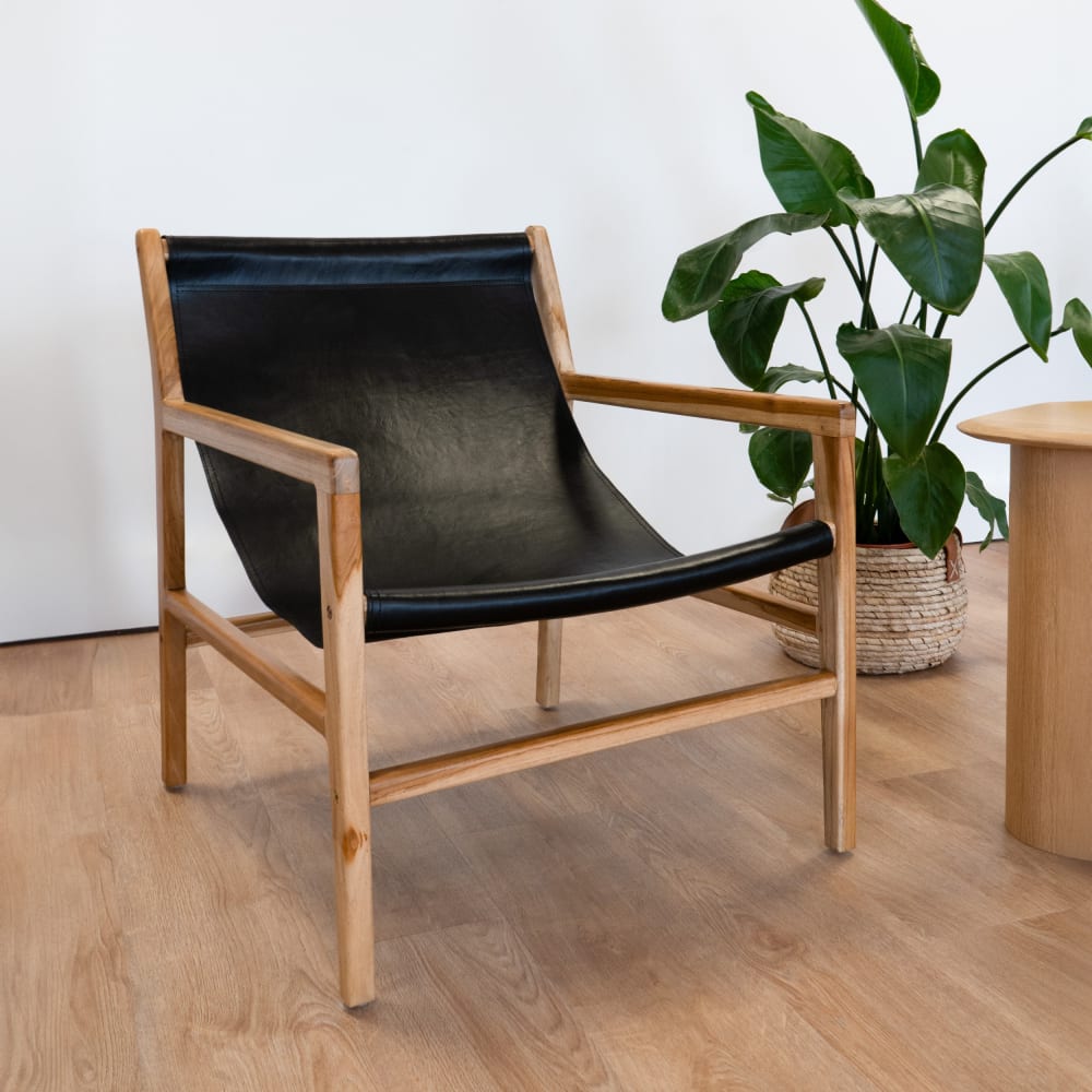 Poltrona lounge in teak e cuoio di vacca nero - Maison Pavane