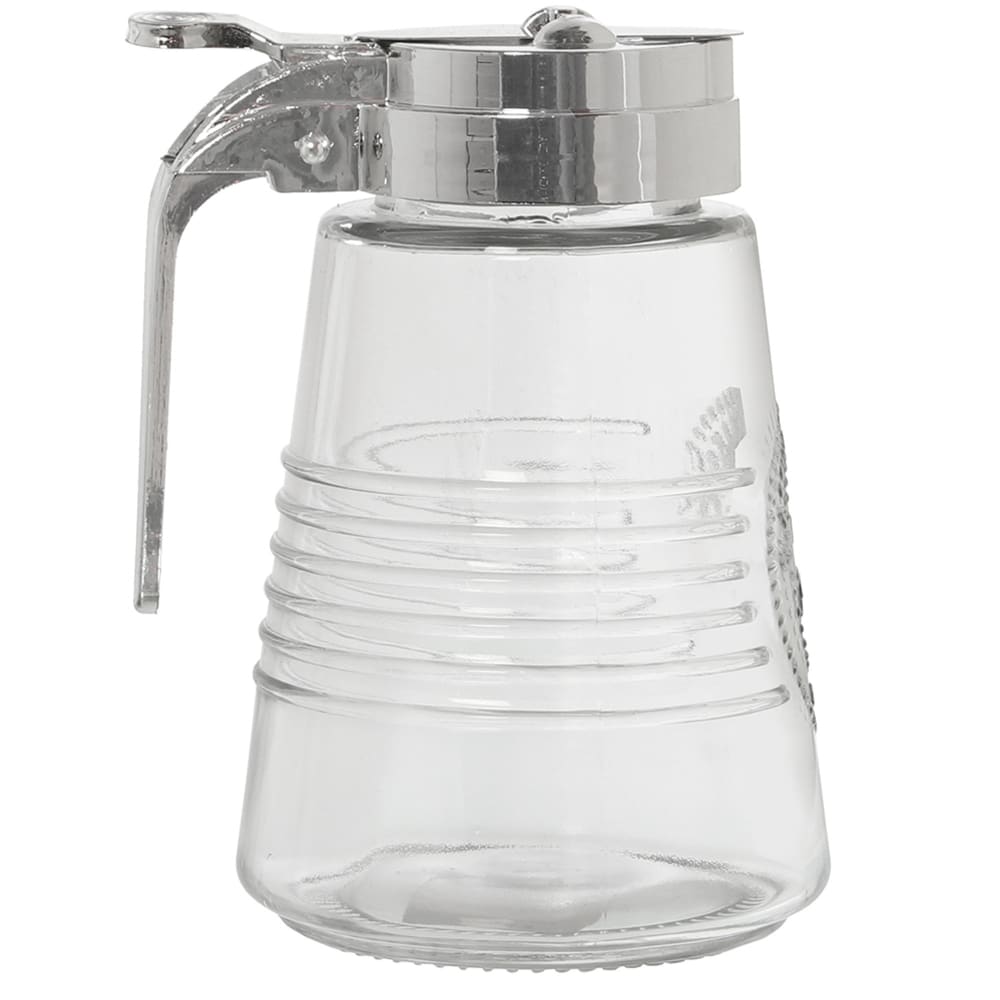 WADIGA Pot à miel en verre transparent et métal chromé. Dimensions: diamètre 8cm x Hauteur 19cm Matière: Verre et Métal Couleur: Transparent et Chrome
