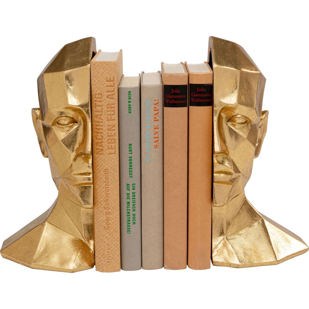KARE DESIGN Ce serre-livres en forme de visage humain doré apporte une ambiance futuriste dans votre intérieur avec ses reliefs angulaires.