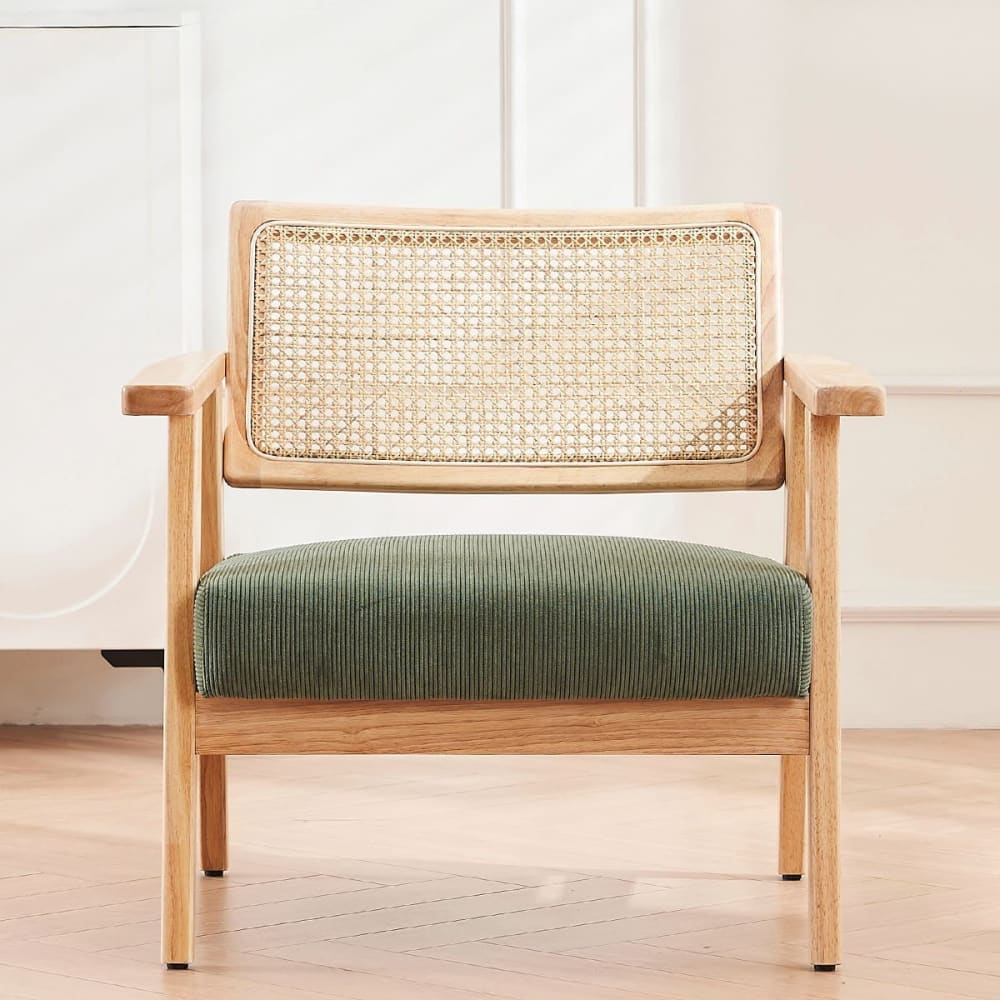 Fauteuil en velours côtelé vert et cannage naturel