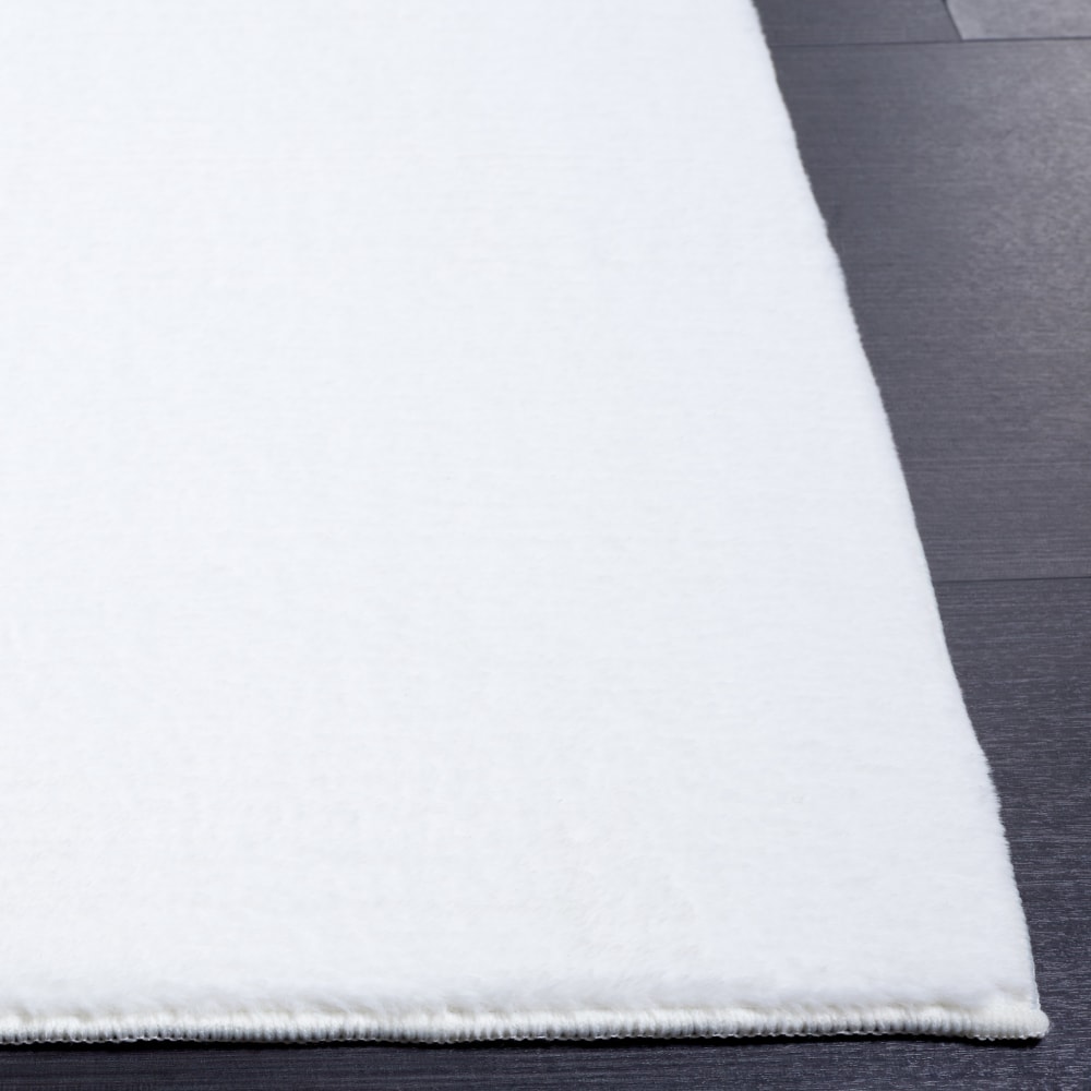 Tapis solide et tonale en polyester blanc, 91 x 152 cm - Maisons du Monde