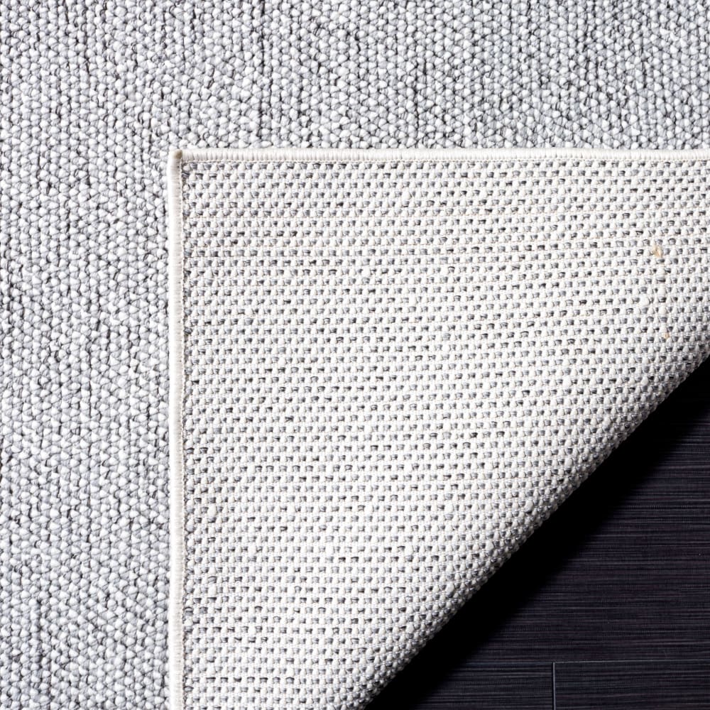 Tapis solide et tonale en polyester gris/blanc, 235 x 305 cm