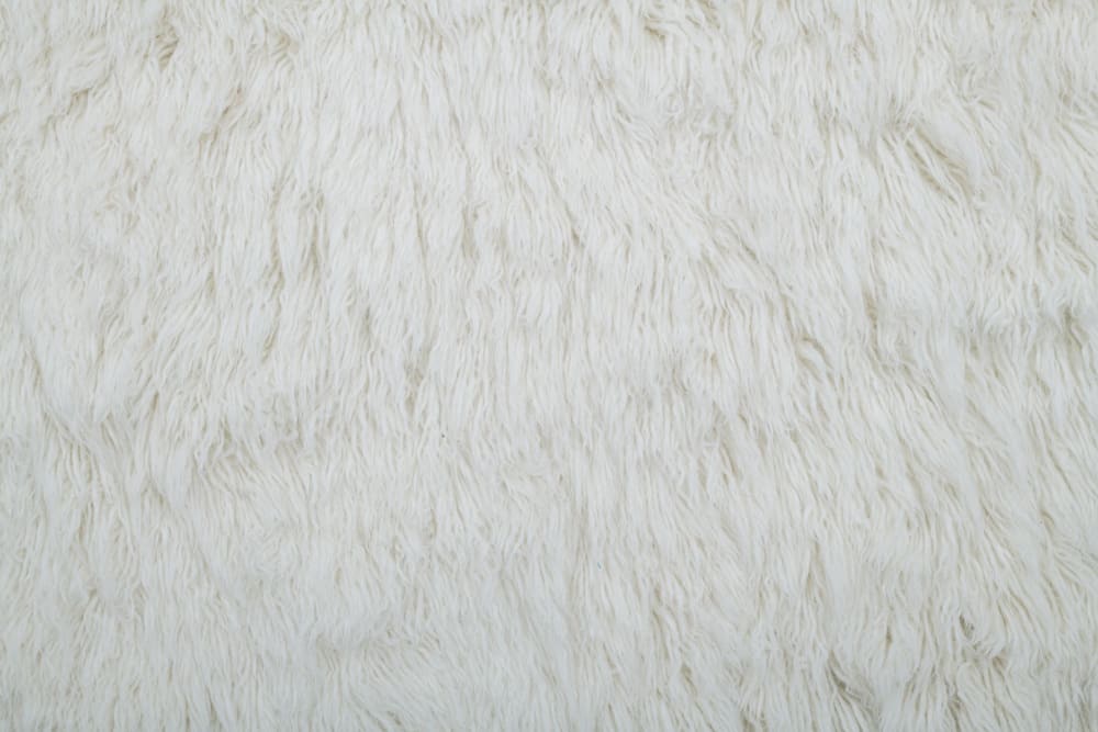 Handgewebter Shaggy-Teppich aus Schurwolle Weiß 140x190 cm -