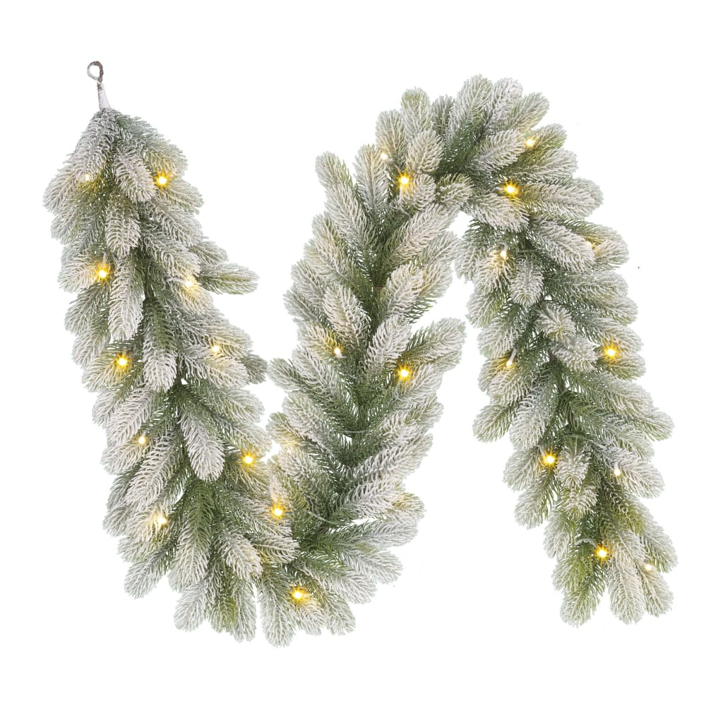 Grüne Weihnachtsgirlande schneebedeckt mit LED-Lichtern L180