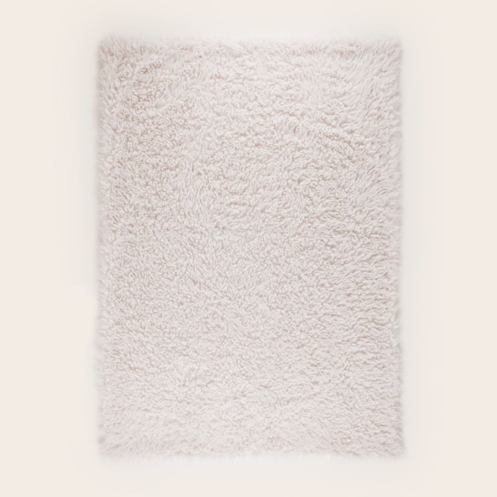 Plaid fausse fourrure duveteuse ecru 140x200 cm