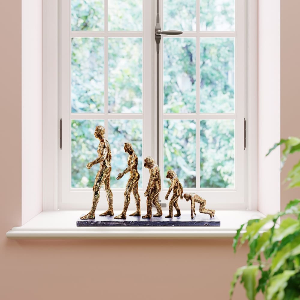 Statuette évolution de l'homme en polyrésine dorée — vue 3
