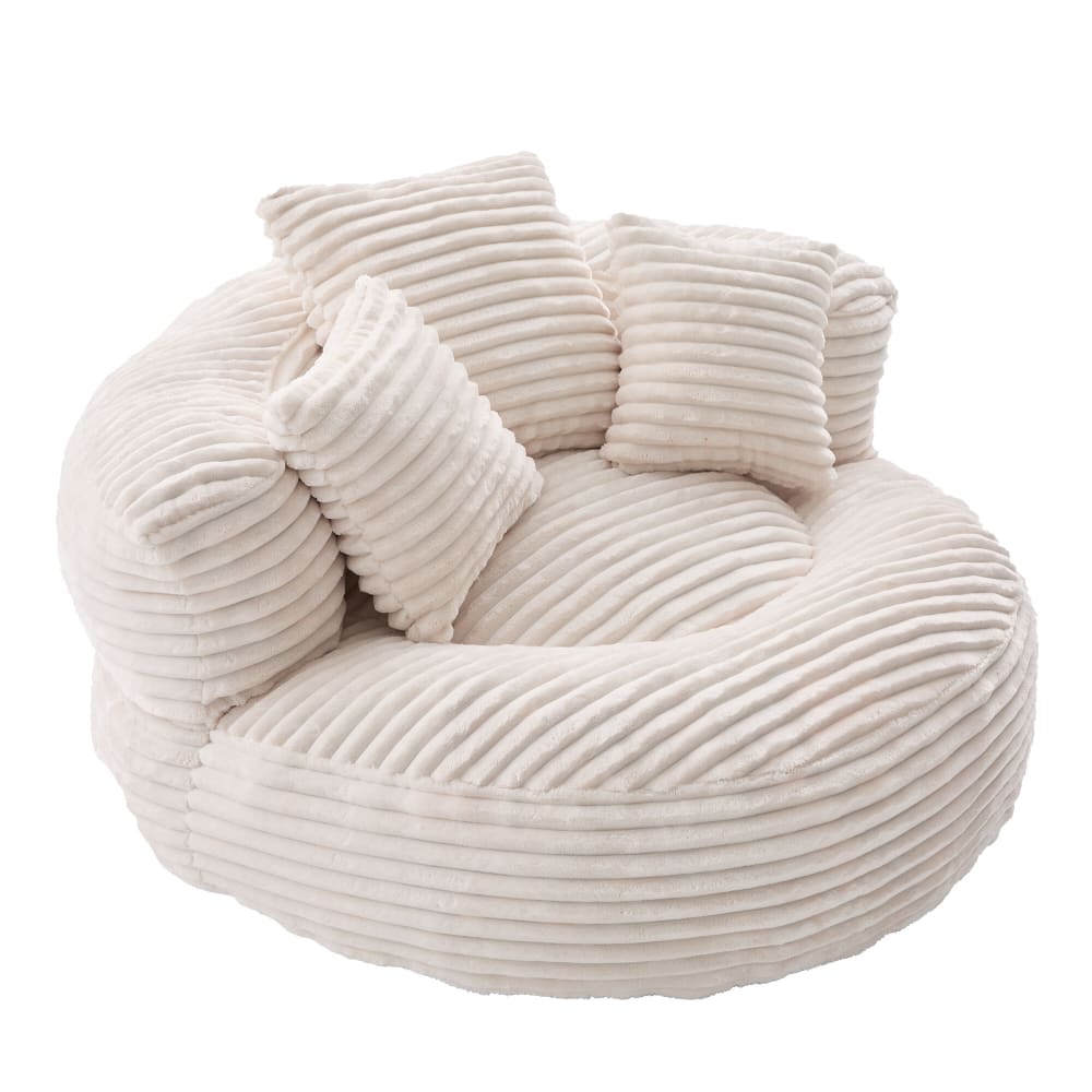 Fauteuil rond en velours côtelé crème avec coussins