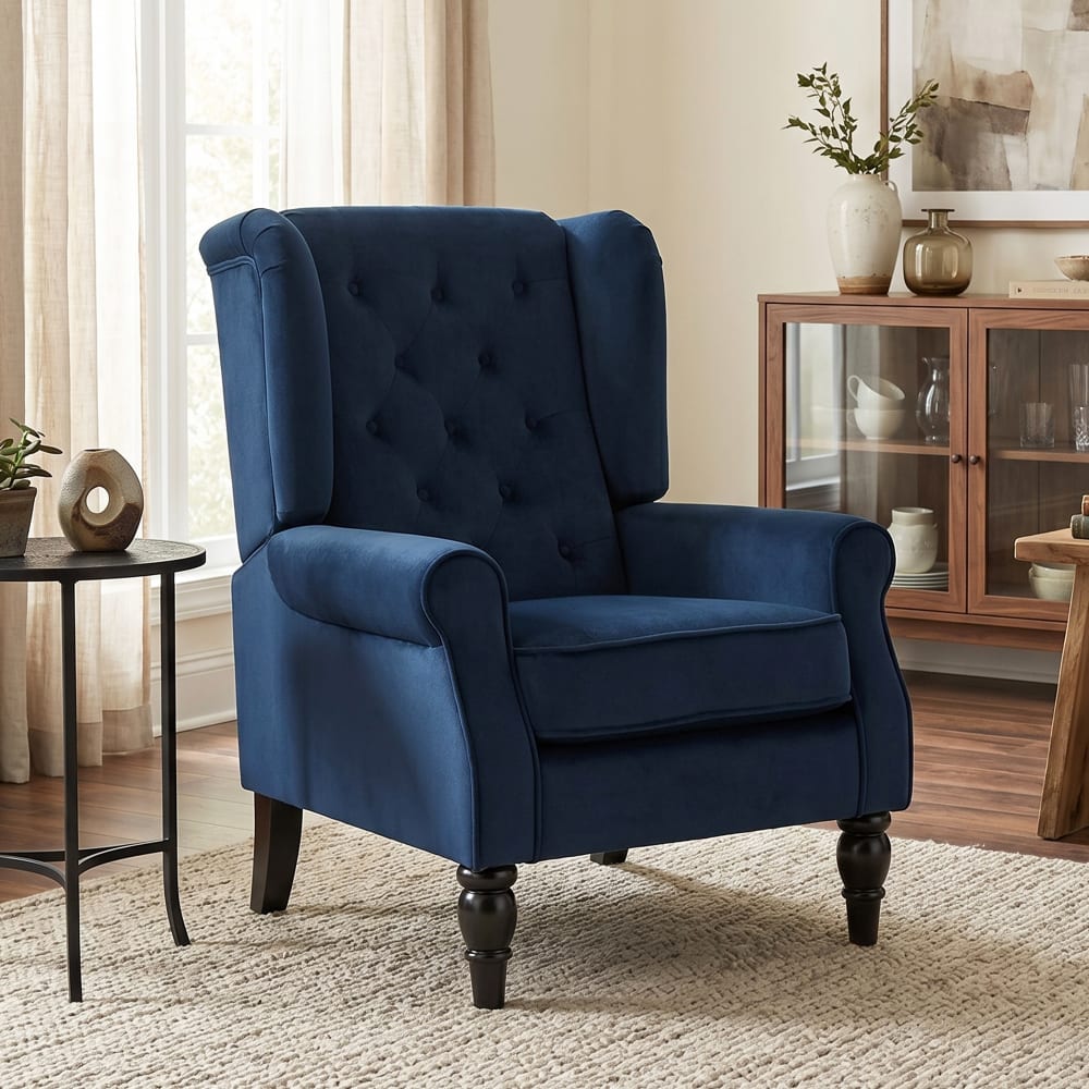 Fauteuil à oreilles dossier haut capitonné tissu velours bleu foncé