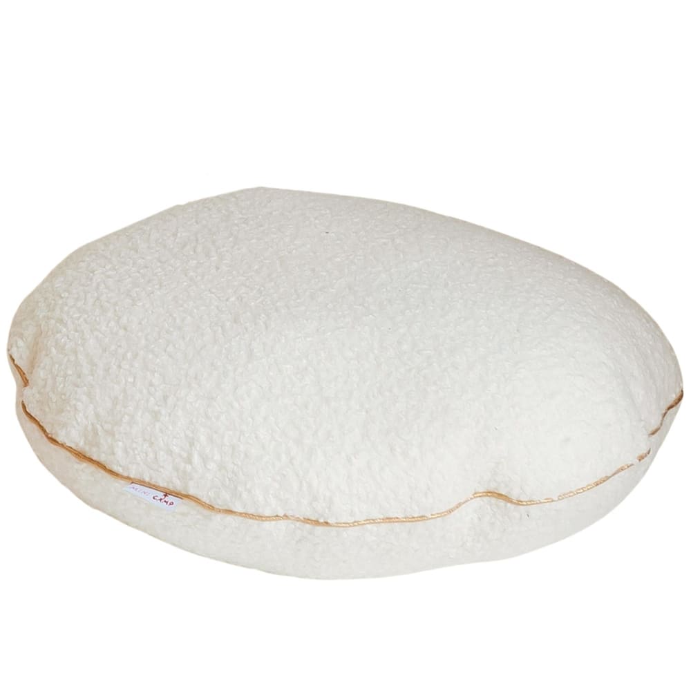 Coussin rond en bouclette avec chic liseré doré
