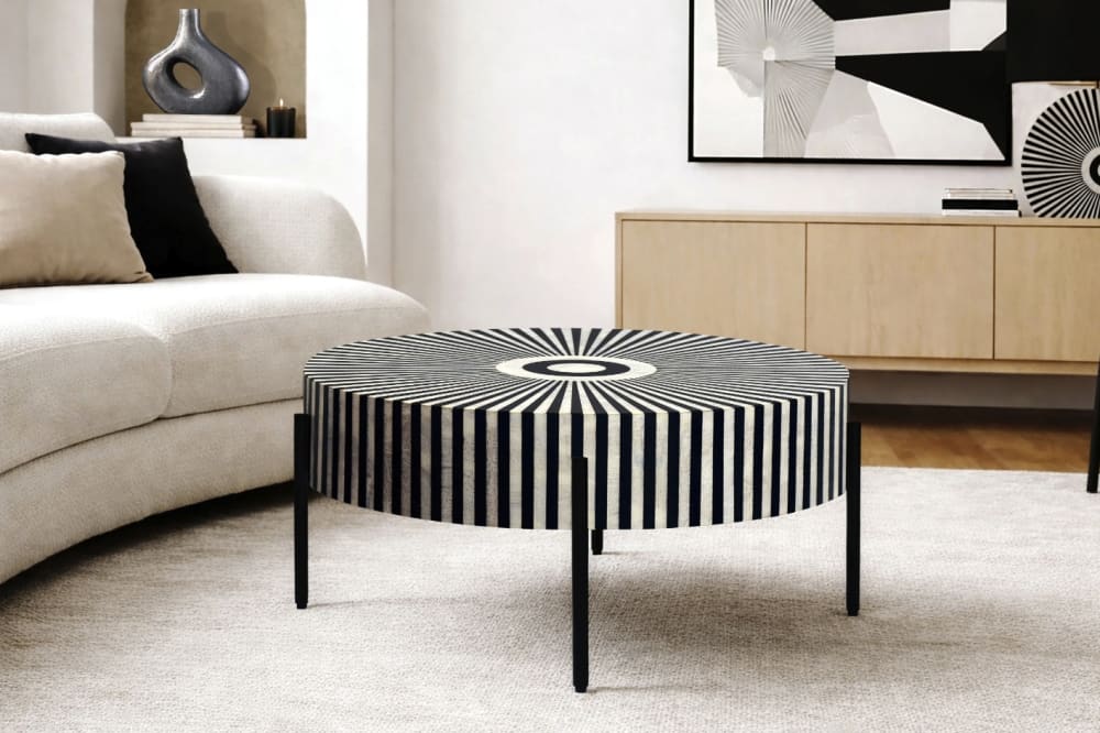 Table basse ronde en résine noir et blanche pieds en fer d64cm