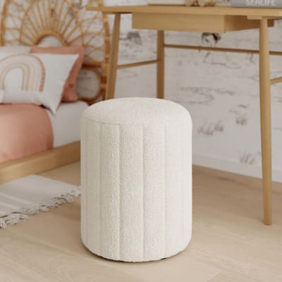 Pouf rond en tissu blanc bouclé