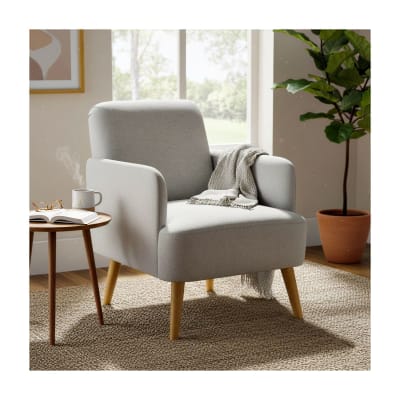 Fauteuil gris clair en tissu rembourré