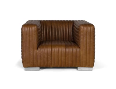 Fauteuil rembourré en cuir de forme cubique et pieds en acier