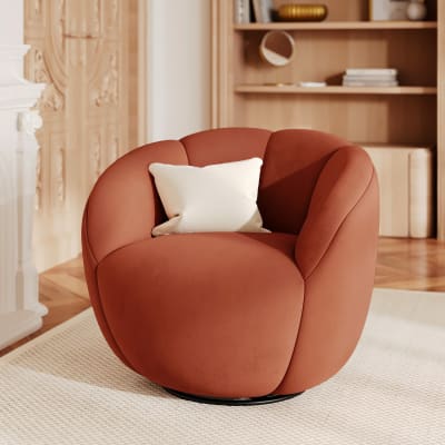 Fauteuil pivotant en velours rouge brique